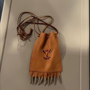 Embroidered Tan Leather pouch.